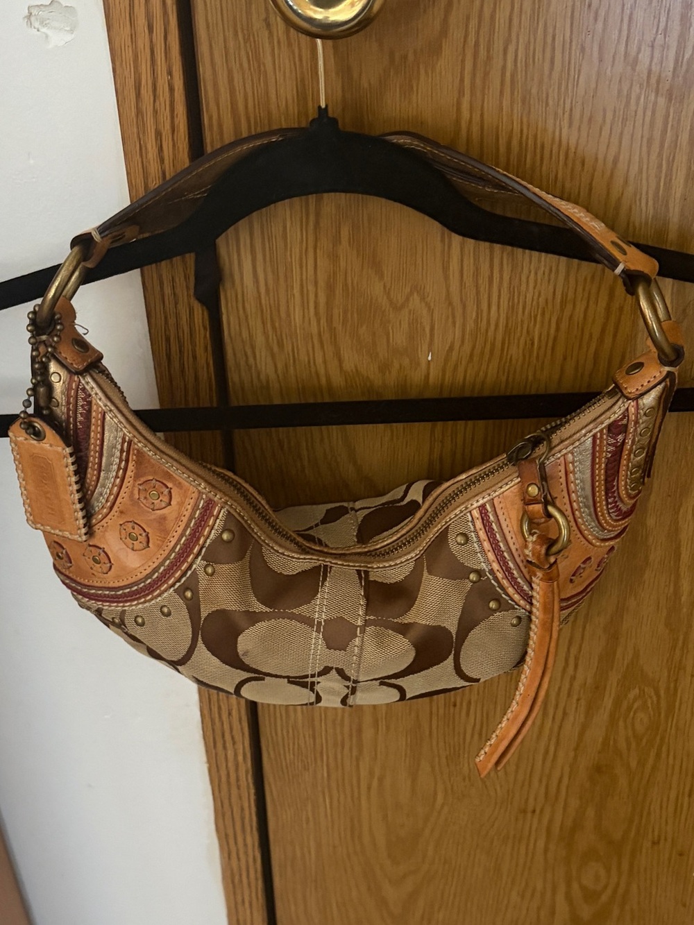 Coach SoHo shoulder bag.  EUC.  Tan signature with ornate leather accents.  RARE